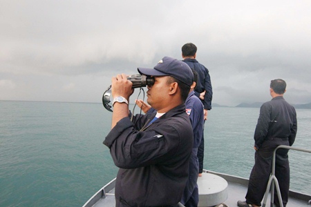 A Navy search and rescue team scours the horizon for signs of the missing Russian tourist.